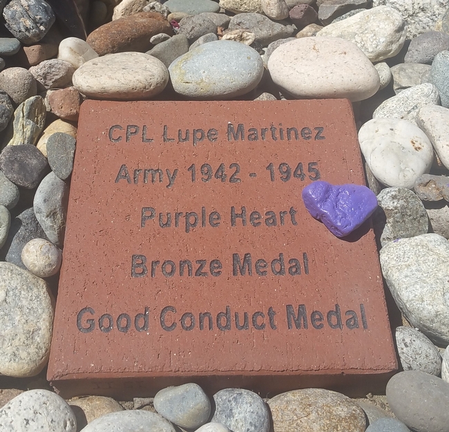 Plaque in Esther's garden commemorating her father-in-law CPL Lupe Martinez for Purple Heart, Bronze Star (Metal) and Good Conduct Medal.