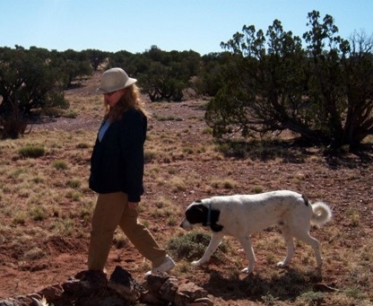 Meredith Hergenrader on her 40-acre farm with family pet, Odin.