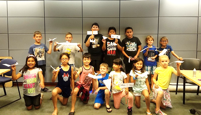 Youth at the Windsor Library Show off their gliders after participating in the 