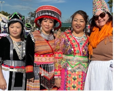 Four women in traditional Hmong clothing