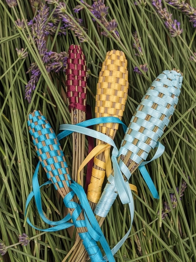 Lavender wands wrapped with colorful ribbons.