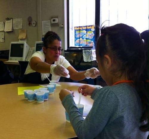 Leticia, King CDC Teacher,  serving students healthy foods