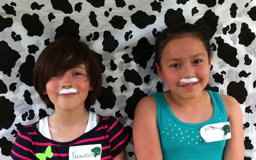 Francesca and Ariianna model their milk mustahes.