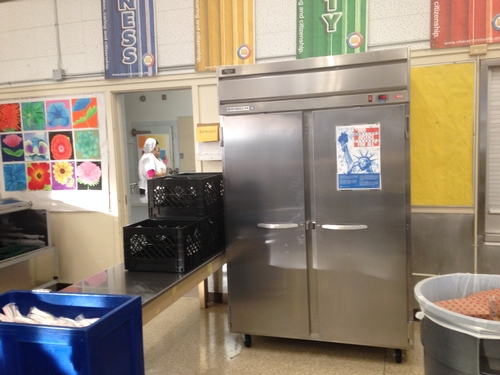 Before: A large freezer blocked off the front of the cafeteria, leaving little room for nutrition education materials and a place to showcase student artwork.