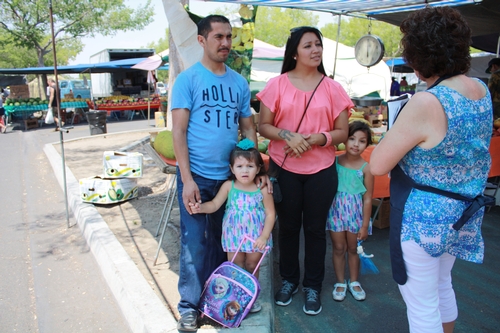 First time shoppers Francisco and his wife and two children said they shop at farmers markets because everything looked very fresh.