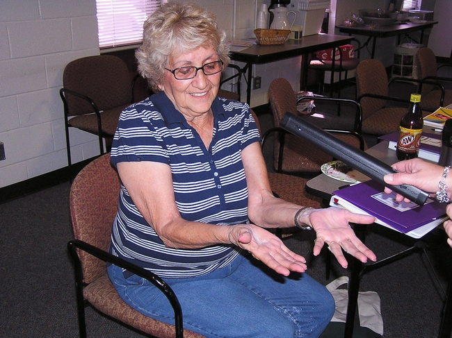 A participant shows off her clean hands