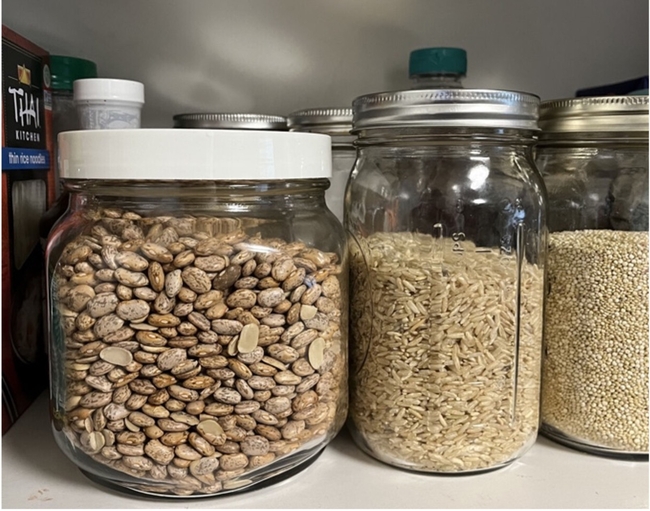 Various grains stored in glass jars.