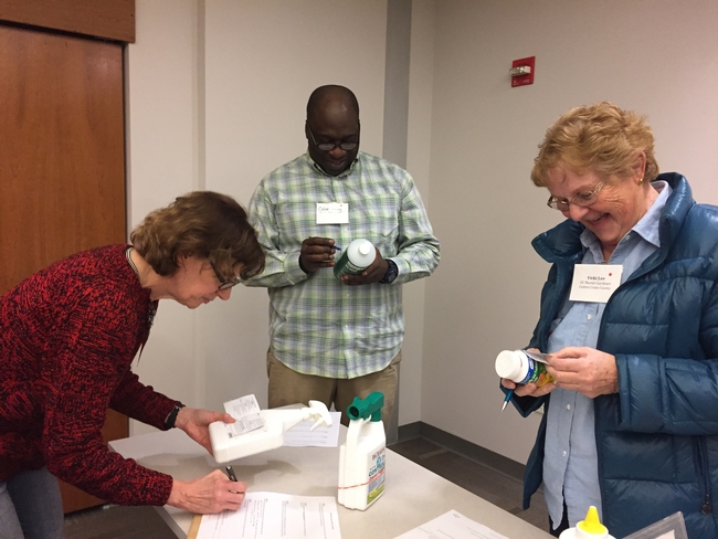 Attendees learn how to read pesticide labels during a hands-on exercise. [A. Schellman]