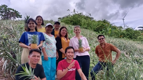 Agritourism Coordinator, Rachael Callahan, with AHSI staff and farmers, visiting a pineapple farm in Rizal.