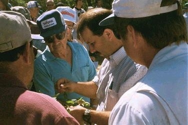 Roger Duncan, center, with almond farmers.