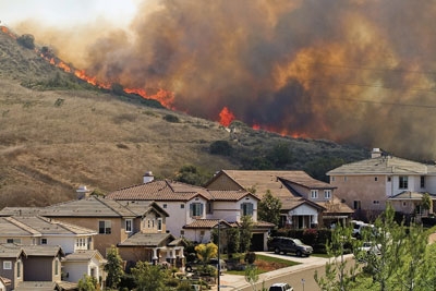 Wildfire threatening a California subdivision.