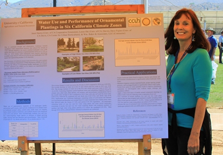 UCCE advisor Janet Hartin with a research poster on plant water use and climate zones.