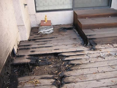 This deck had debris in the board gaps that caught fire.