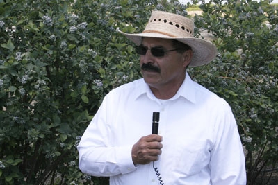 Manuel Jimenez speaks at a recent blueberry field day.