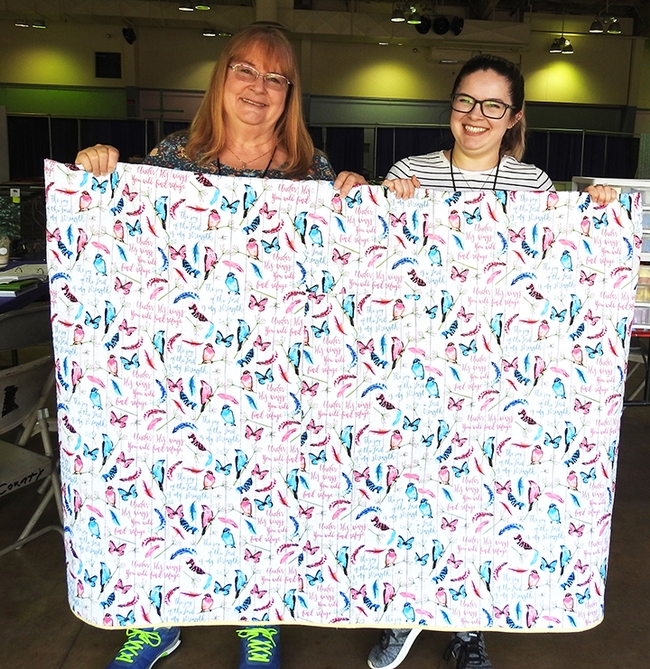 McCormack Hall superintendent Sharon Payne (left) and daughter Julianna Payne Brown, assistant superintendent, display a quilt.