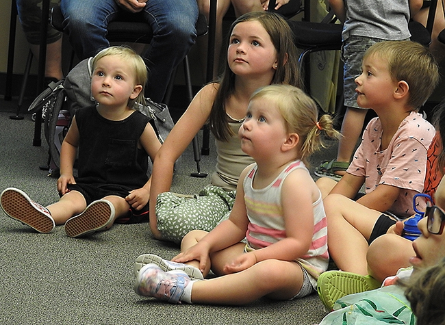 The Bohart Museum of Entomology  insect presentation fascinates these youngsters at the Vacaville Public Library. (Photo by Kathy Keatley Garvey)