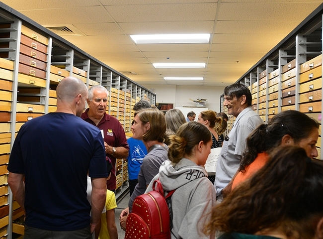 Entomologist Jeff Smith, who curates the Lepidoptera collection at the Bohart Museum, answers questions from the crowd at a recent Bohart Museum Moth Night open house. (Photo by Kathy Keatley Garvey)