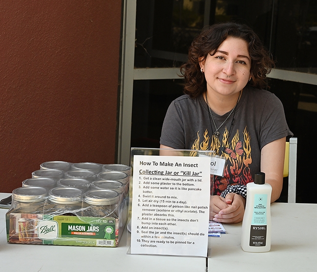UC Davis entomology senior Sol Wantz, president of the Entomology Club, showed open house visitors how to make an insect collecting jar or 