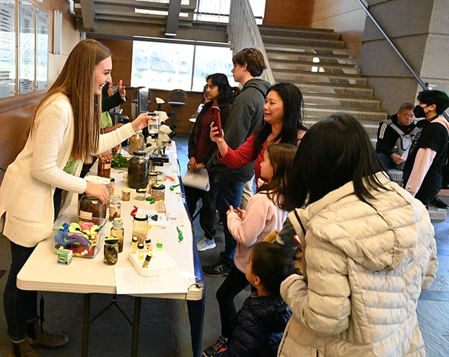Nematologist Alison Blundell, a graduate student in the Shahid Siddique lab, shows nematode specimens at the 2023 UC Davis Biodiversity Museum Day. (Photo by Kathy Keatley Garvey)