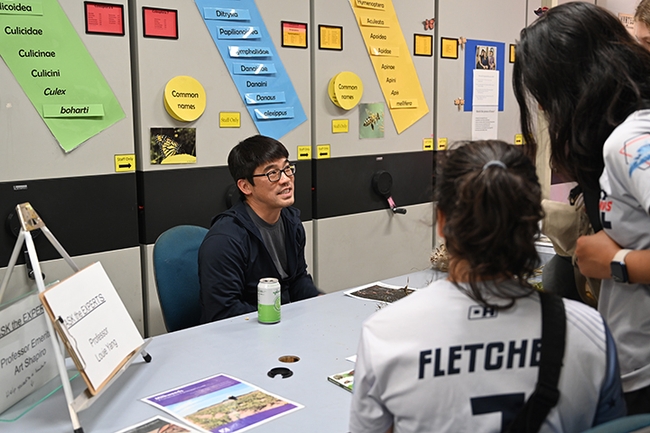 Community ecologist Louie Yang, professor, UC Davis Department of Entomology and Nematology, answers questions at a Bohart Museum of Entomology open house on 