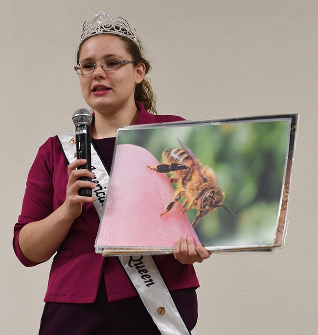 American Honey Queen Kaelyn Sumner of Cecil, Wisc., a senior at Kansas State University discussed queen bees, worker bees and drones. (Photo by Kathy Keatley Garvey)
