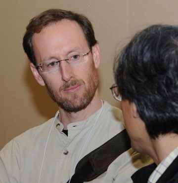 Jay Rosenheim speaking to a colleague at a meeting of the Entomological Society of America in 2009. (Photo by Kathy Keatley Garvey)