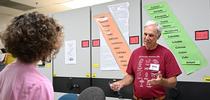 Bohart Museum associate Michael  Pitcairn, retired from the California Department of Food and Agriculture, answers questions about silkworm moths and textiles. (Photo by Kathy Keatley Garvey) for Bug Squad Blog