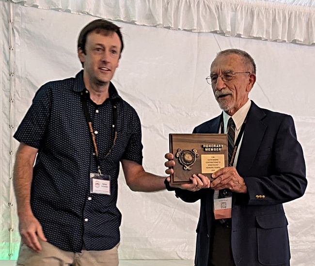 UC Davis Distinguished Emeritus Professor Howard Ferris (right) receives his Honorary Member award at the Society of Nematologists' meeting. With him is awards presenter Nathaniel Schroeder of Crops Science, University of Illinois, Urbana-Champaign. (SON Photo)