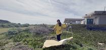 UC Davis doctoral student and medical entomologist CC Edwards dragging for ticks at Bodega Bay. for Bug Squad Blog