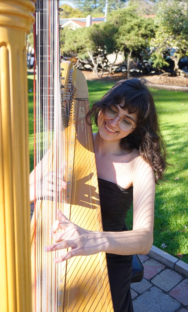 Samantha Murray performing on the harp.