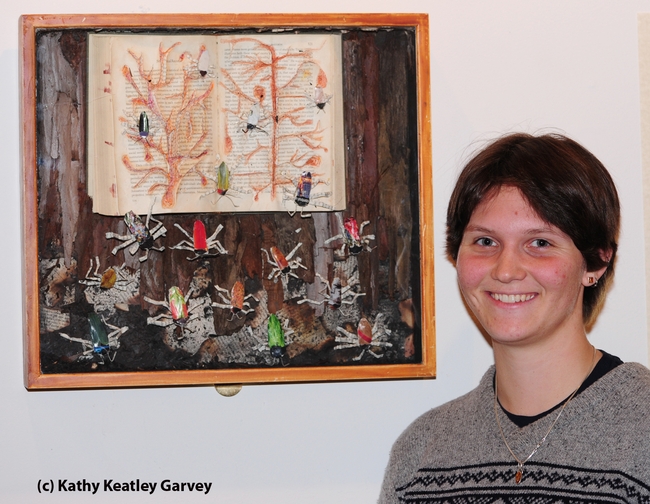 Whitney Krupp with her beetle art work. (Photo by Kathy Keatley Garvey)