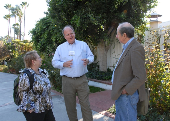 Kelli Hoover of Penn State chats with Kevin Heinz (center) of Texas A&M and Bruce Hammock of UC Davis at a meeting of the Entomological Society of America. (Photo by Kathy Keatley Garvey)