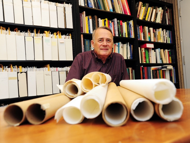 UC Davis Distinguished Professor James R. Carey with some of the maps he used in his research. (Photo by Kathy Keatley Garvey)