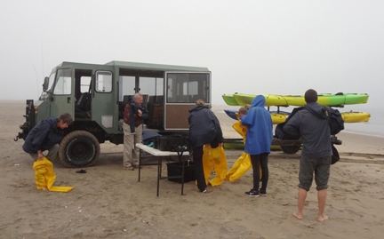 James R.Carey (far left) preparing for kayaking with fur seals at Walvis Bay, Namibia, Africa (Photo by Patty Carey)