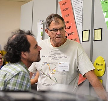 Rosser Garrison (right) talks with Andrew Rehn of Sacramento, who received his doctor from UC Davis in 2000 (major professor Lynn Kimsey). Rehn is now a stream ecologist with the California Department of Fish and Wildlife. (Photo by Kathy Keatley Garvey)