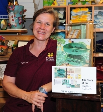 Entomologist Fran Keller, a Bohart Museum associate, with a children's book she wrote. It's illustrated by Greg Kareofelas and Laine Bauer. (Photo by Kathy Keatley Garvey)