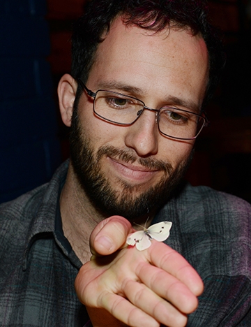 Jacob Montgomery, a masters student in ecology at UC Davis, with the first cabbage white of 2016. (Photo by Kathy Keatley Garvey)