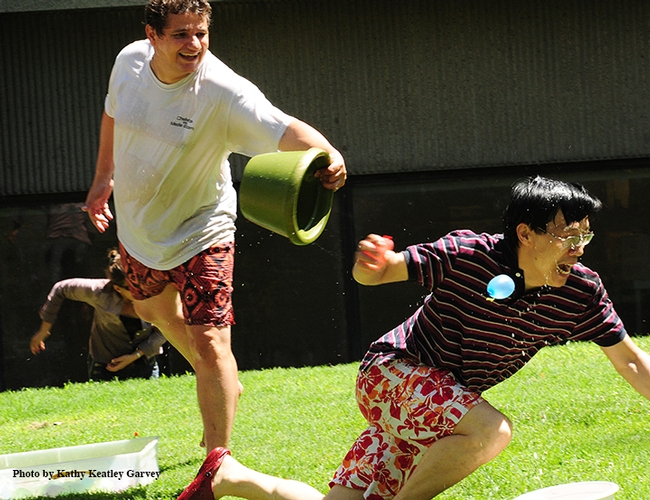 Christophe Morisseau (left) a researcher in the Hammock lab and organizer of the yearly balloon battles, chases a fellow water warrior, postdoctoral scholar Pingxi Xu of the Walter Leal lab. (Photo from 2012, Kathy Keatley Garvey)