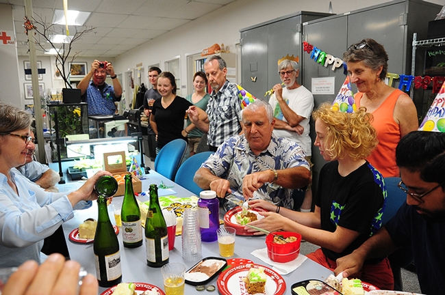 Entomologist Jeff Smith (center) is surrounded by friends and colleagues at his surprise birthday party. They enjoyed carrot cake, ice cream and sparkling apple juice. (Photo by Kathy Keatley Garvey)