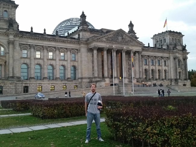 World traveler and scientist Matan Shelomi, wearing a Bohart Museum of Entomology shirt at  at the Reichstag in Berlin.
