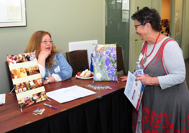 Beekeeper Sharon Schmidt (left), who founded the Cascade Girl Organization in Oregon and serves as its volunteer executive director, talks to Amina Harris, executive director of the UC Davis Honey and Pollination Center at the 2017 UC Davis Bee Symposium. (Photo by Kathy Keatley Garvey)