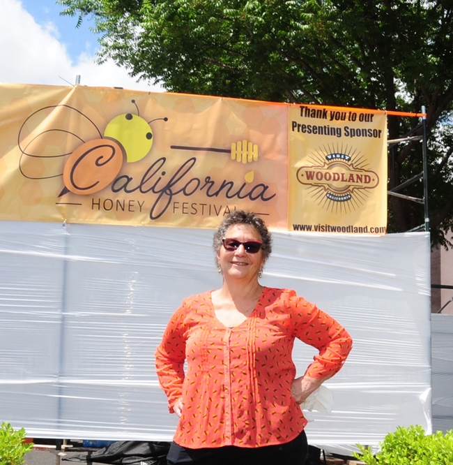 Amina Harris, director of the UC Davis Honey and Pollination Center, stands ready to greet visitors to the second annual California Honey Festival, set all day Saturday, May 5 in downtown Woodland. (Photo by Kathy Keatley Garvey)