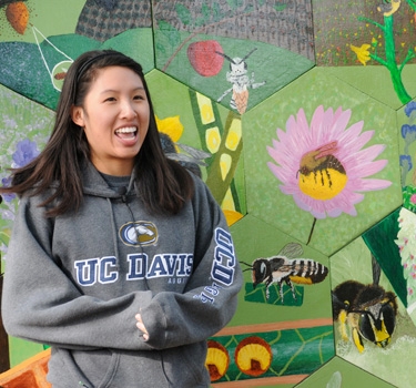 At the completion and celebration of the mural back in 2011, Christine Chen talks about how she created the image of the European wool carder bee. (Photo by Kathy Keatley Garvey)
