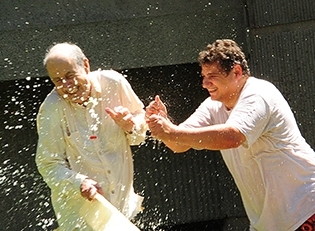 The Splash Brothers: Bruce Hammock (left), UC Davis distinguished professor and researcher Christophe Morisseau engage in a water battle. (Photo by Kathy Keatley Garvey)Just call it 