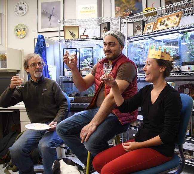 A toast! From left are Phil Ward, UC Davis professor of entomology; Amir Ghoddoucy, formerly with the California Department of Food and Agriculture; and Jessica Gillung, new Ph.D. who is heading to Cornell for her postdoctorate fellowship. (Photo by Kathy Keatley Garvey)