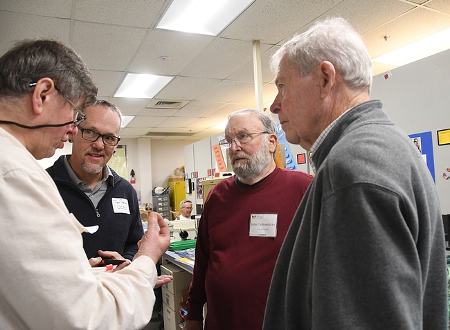Engrossed in conversation are (from left) Max Klepikov, Jim Detla, John DeBenedictis and Jerry Powell. (Photo by Kathy Keatley Garvey)