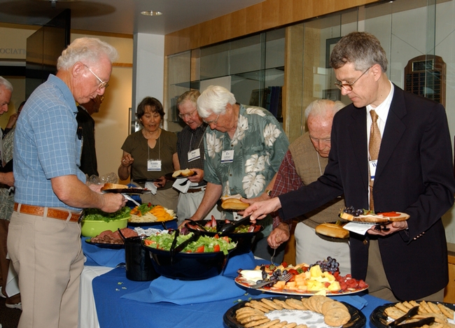 This was the scene at the 2007 UC Davis Entomology Alumni Reunion. At right is chemical ecologist Walter Leal, then chair of the Department of Entomology (now the Department of Entomology and Nematology). (Photo by Kathy Keatley Garvey)