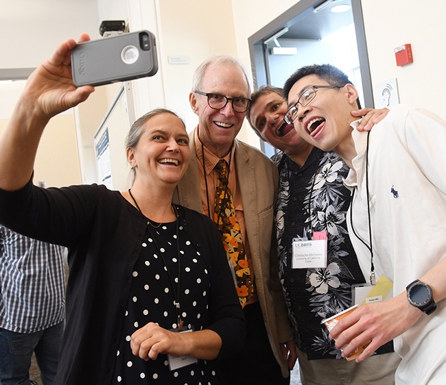 Fun at the lab reunion: Karen Wagner, Hammock lab alumnus, takes a selfie with Jim Sanborn, retired from UC Davis; researcher Christophe Morisseau of the Hammock lab,  and Kin Sing Stephen Lee of Michigan State University, an alumnus of the Hammock lab. (Photo by Kathy Keatley Garvey)