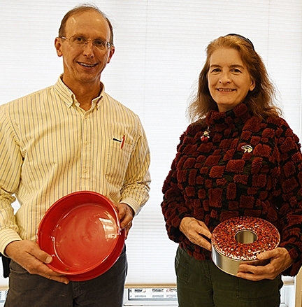 Steve Nadler, professor and chair of the UC Davis Department of Entomology and Nematology, and professor Sharon Lawler with their empty containers. (Photo by Kathy Keatley Garvey)