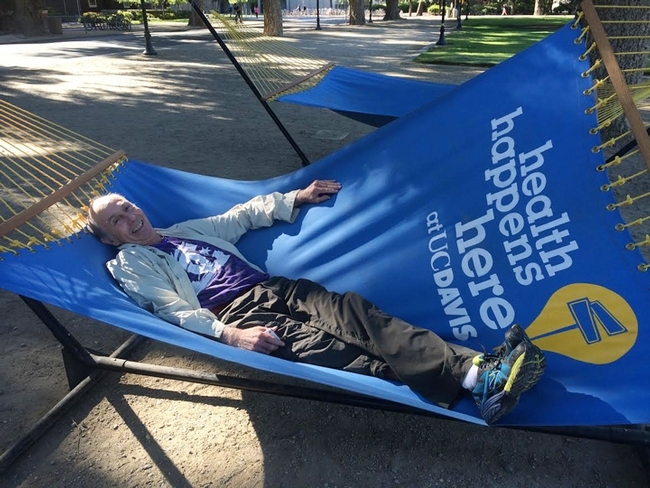 Bruce Hammock in a Hammock on the UC Davis Quad. Note: He doesn't spend much time in a hammock; he just posed for this photo. (Photo by Cindy McReynolds)